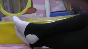 candid white sock layered with black stirrup tights