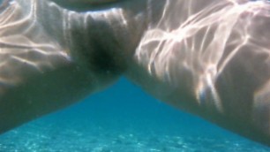 My wife peeing under water in the sea