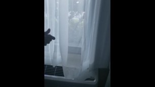 stroking at hotel window show