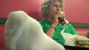 Young college boy feet in restaurant
