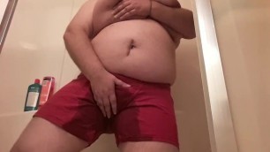 Holding and Wetting in red boxershorts