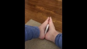 sexy college girl massages lotion on her high arched feet and toes